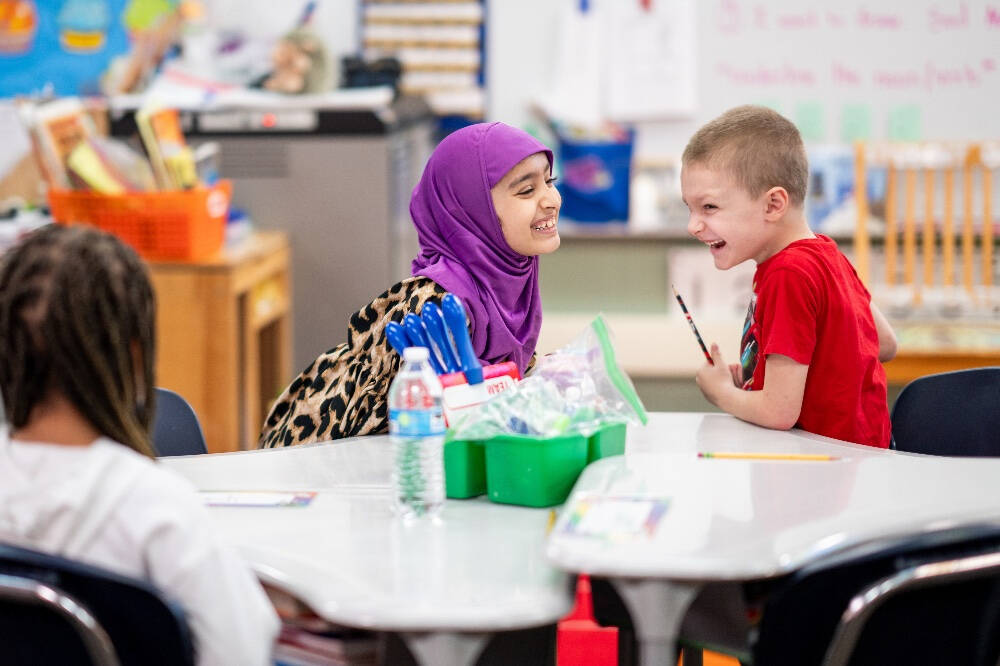 Battle Creek students laughing in their classroom